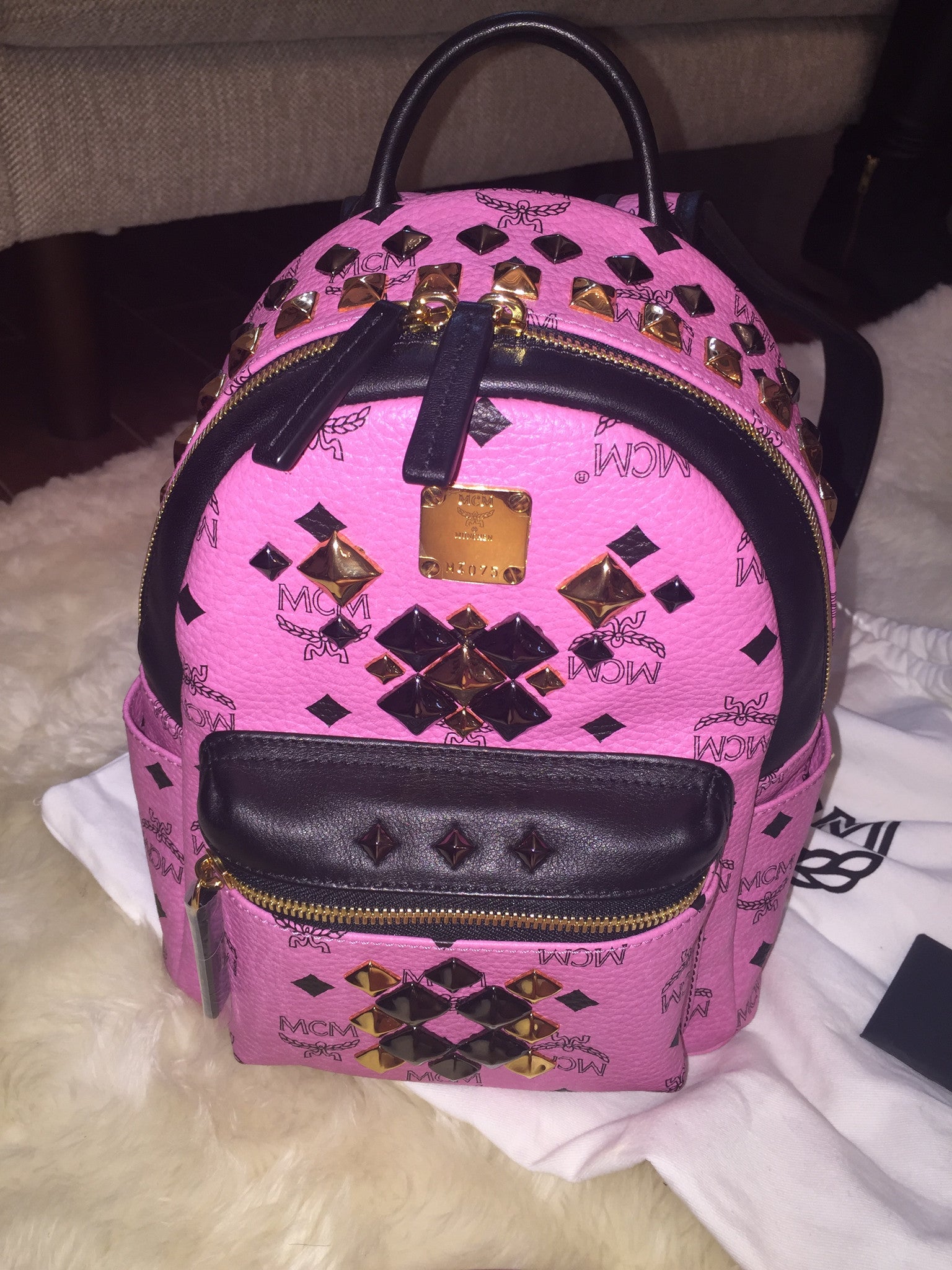 Pink and black mcm on sale bag